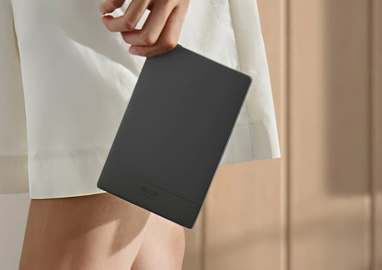 Person holding BOOX Go 6 e-ink reader in a minimal, modern setting